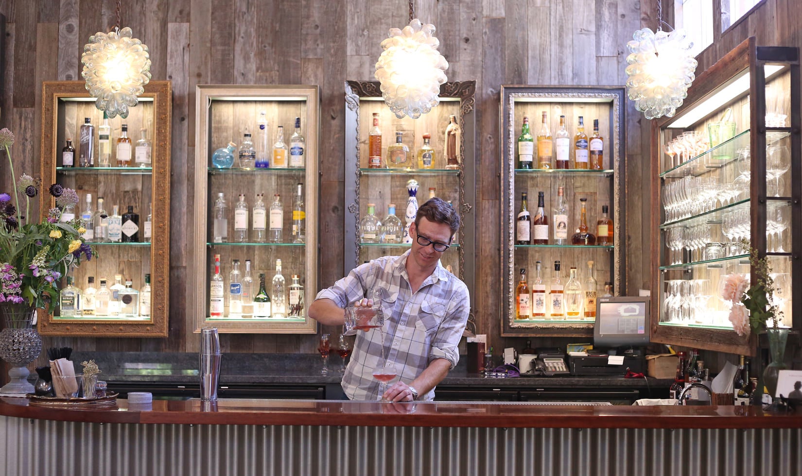 an expert wine crew in a wine bar mixing wines