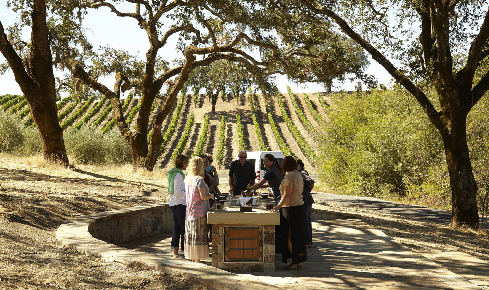 guests enjoying a pour of wine on a stop on The Estate Tour at Jordan Winery