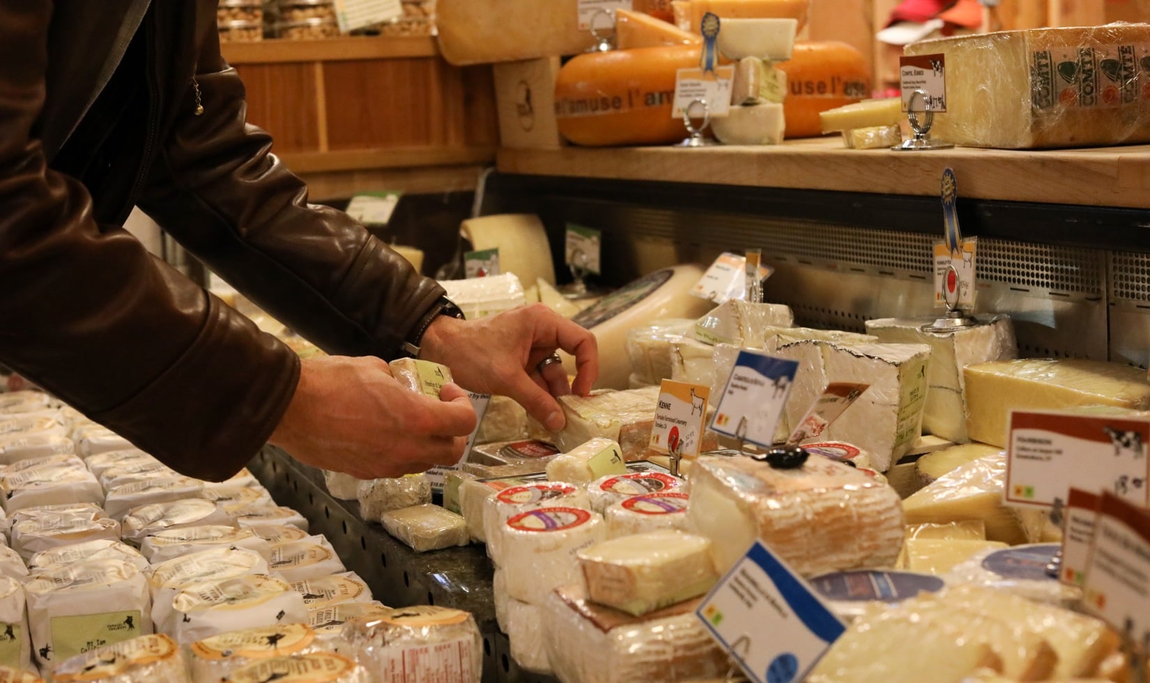 Cheese and Cabernet Sauvignon Pairing a person wrapping the cheese and putting tags