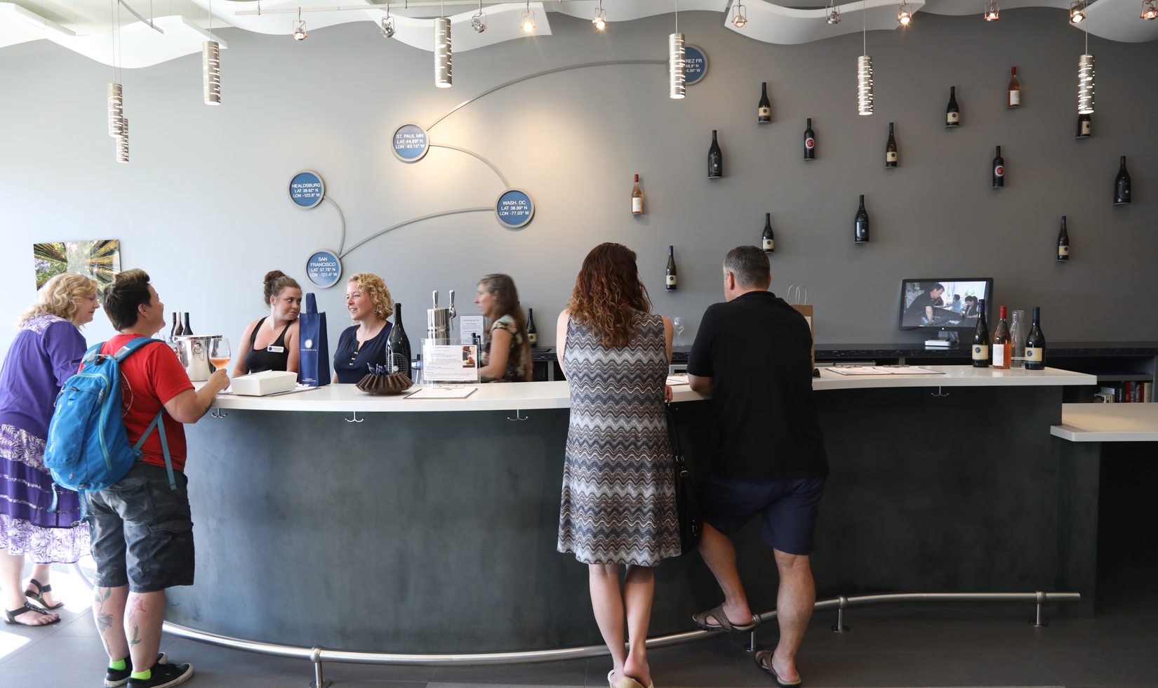 people entering to wine store looking to buy wines