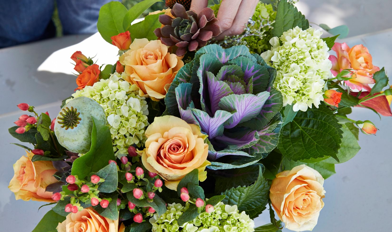 Summer Floral Arrangements Ideas for Home Floral centerpiece with ornamental cabbage, smooth hydrangea, orange spray roses and orange flame calla lily