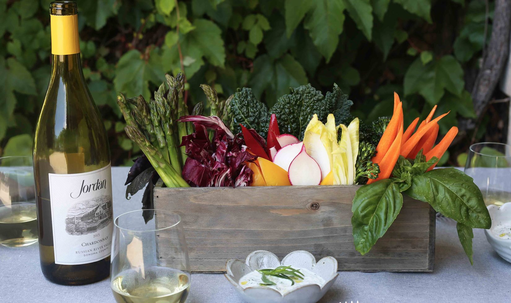 wine with plants and wine glasses in a table
