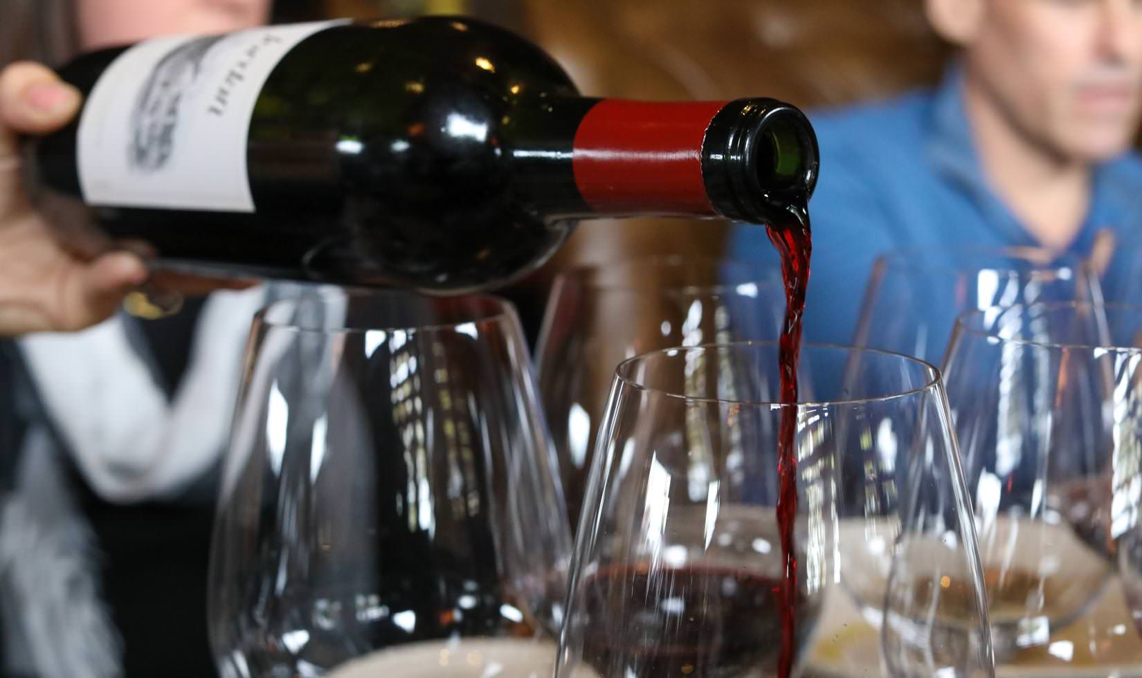 Jordan Winery Cabernet being poured into a wine glass at a steak and Cabernet pairing dinner