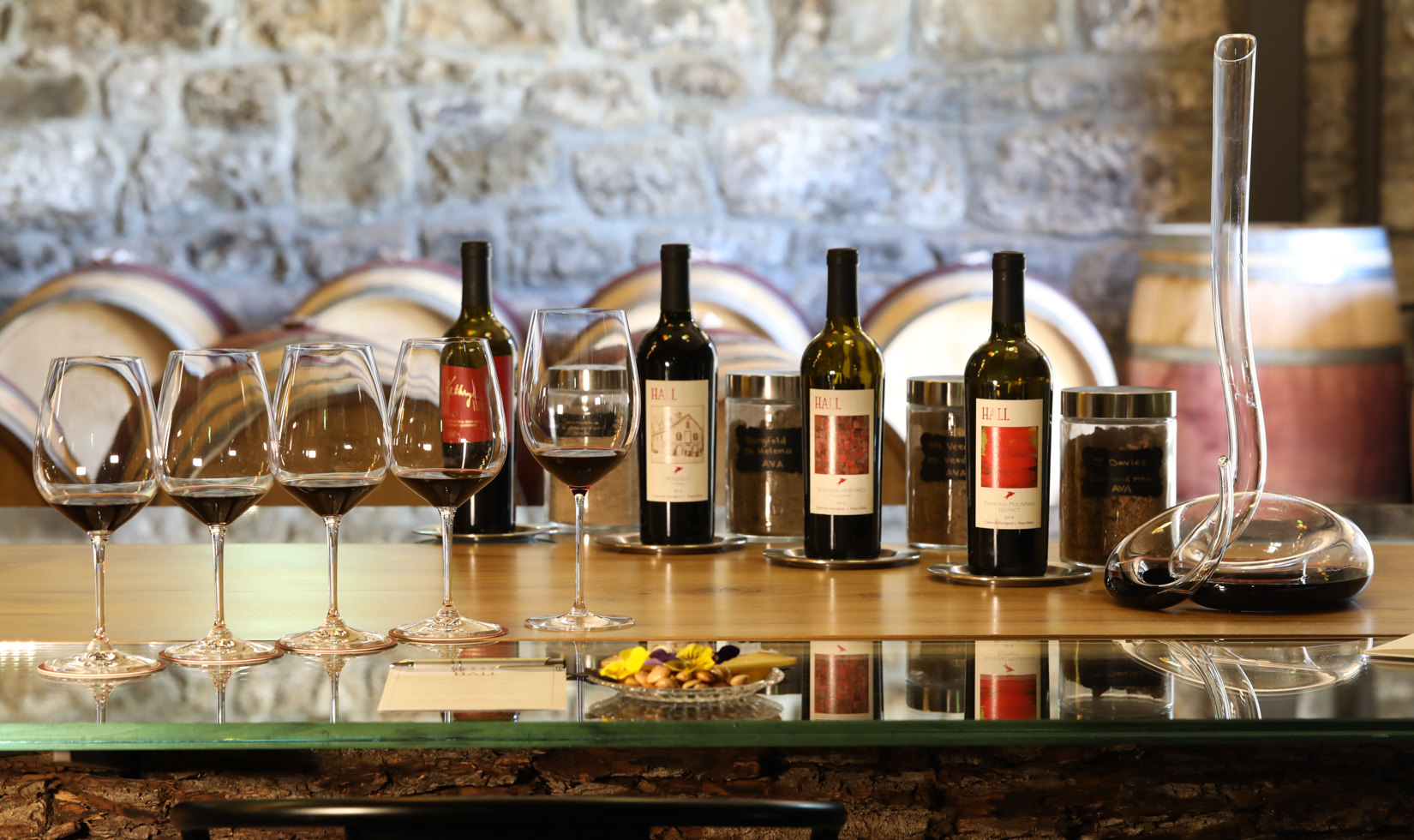 wine bottles and wine glasses in the table