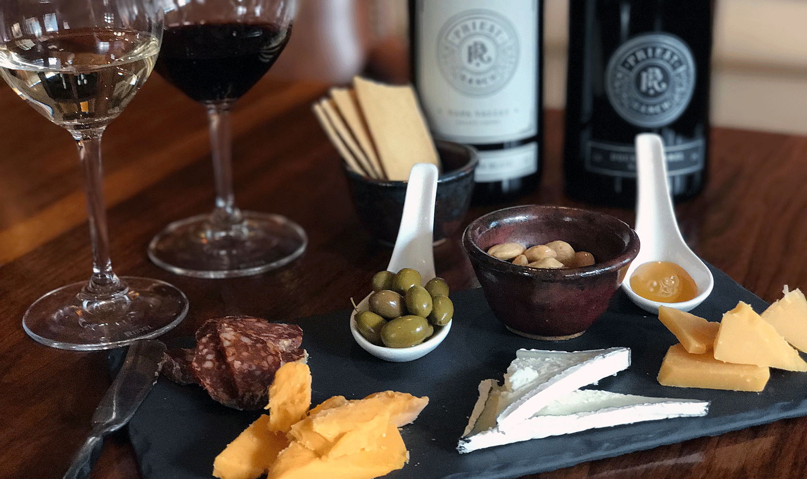 Napa Wine and Cheese Tasting WIneries cheese and wine tasting with pickles, bread and biscuits