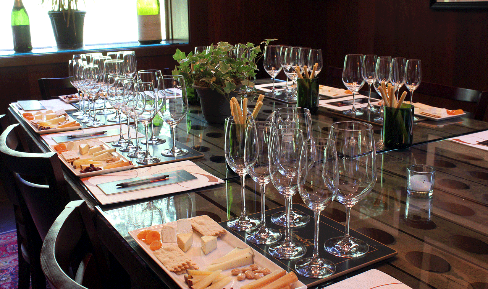 wine glasses and wine with food pairing preparation in the table