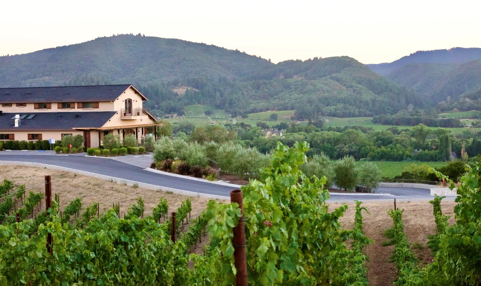Wineries with a View in Healdsburg, Sonoma County Winery building with rolling hills and vineyard in the background