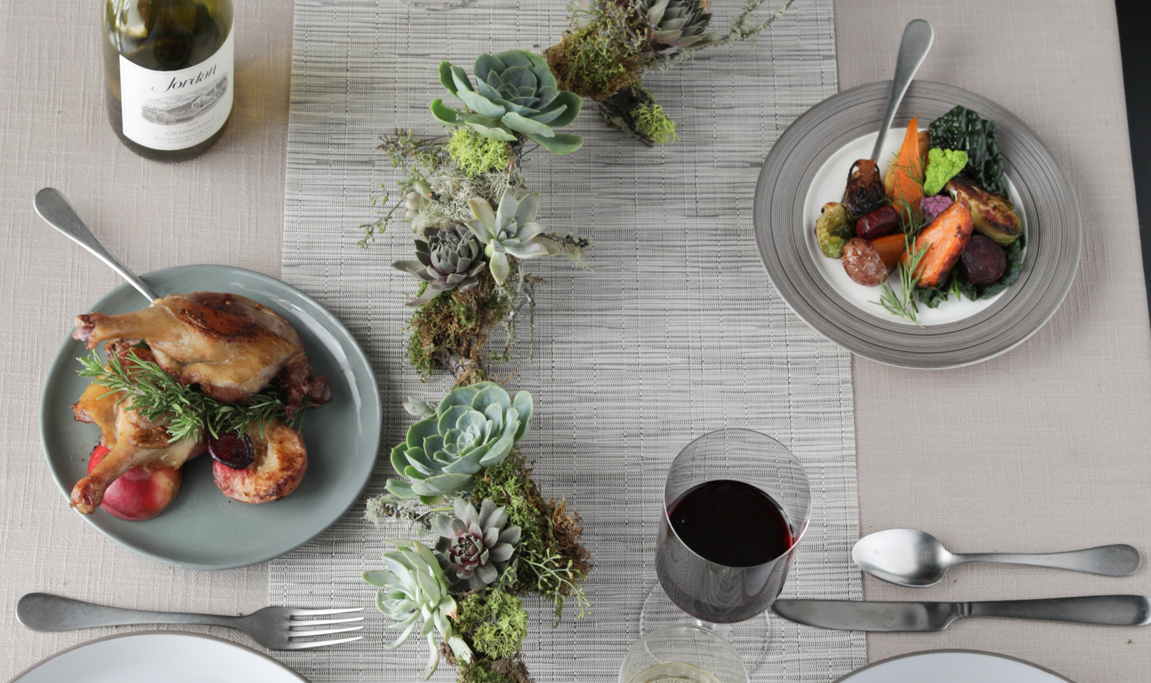 Gourmet dishes with wine and succulent centerpiece table decor Thanksgiving Holiday Tablescape Centerpiece with branches and succulents