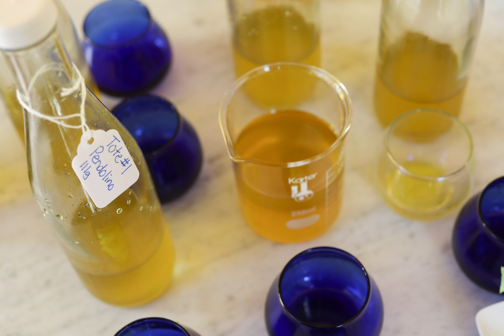 Olive Oil Health Benefits olive oil blending and measured in the beaker
