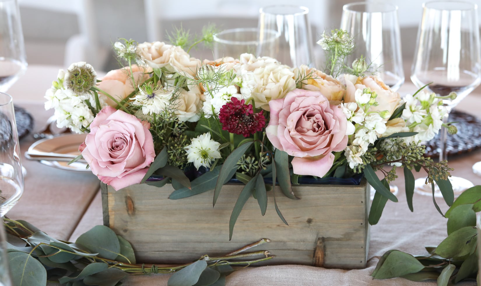floral_table_centerpiece_wine_glasses Floral arrangement idea, rustic summer centerpiece with roses, scabiosa, white stock