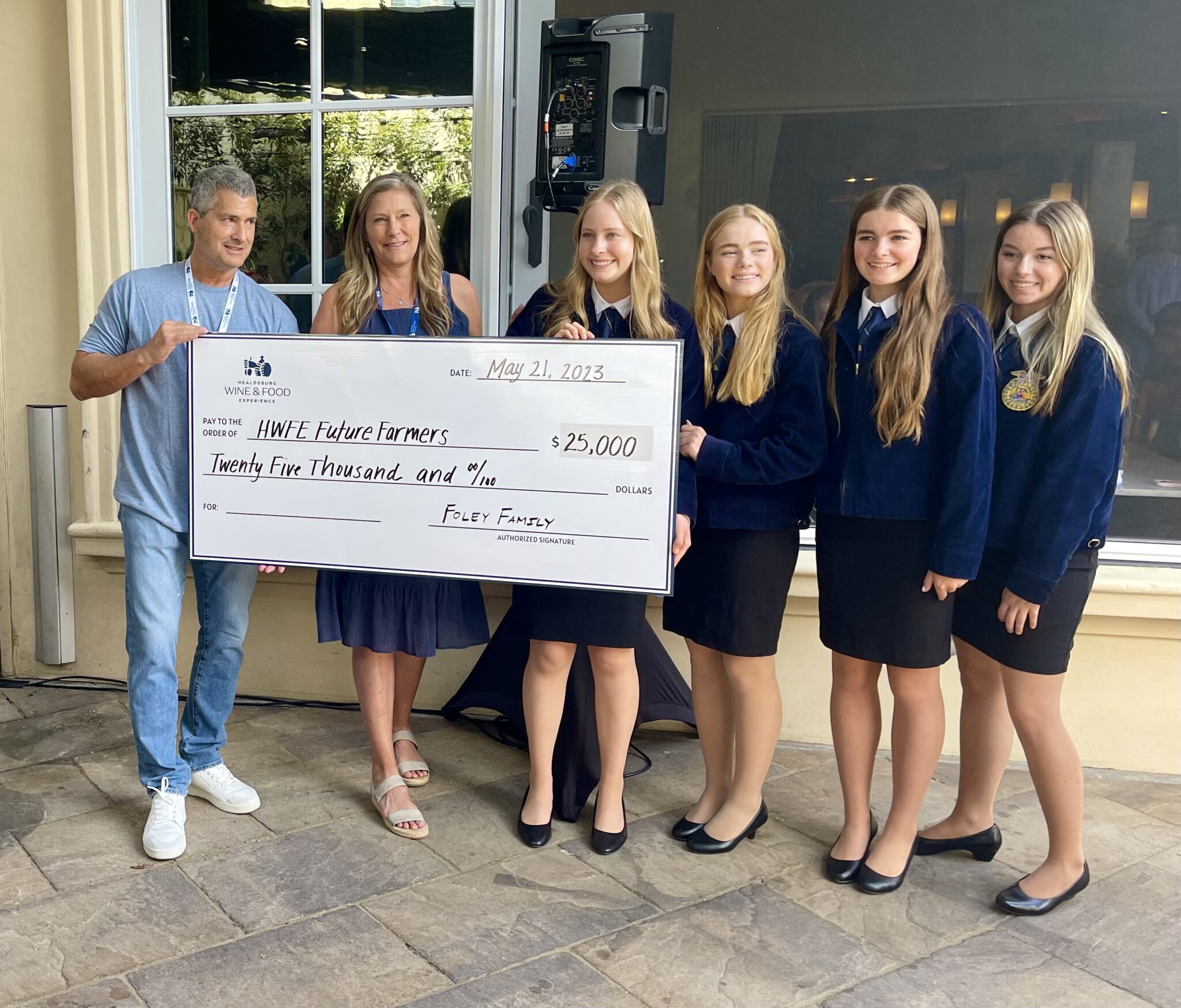 Wine Companies that Donate to Charity 1 A giant check being presented to representatives of the FFA charity.