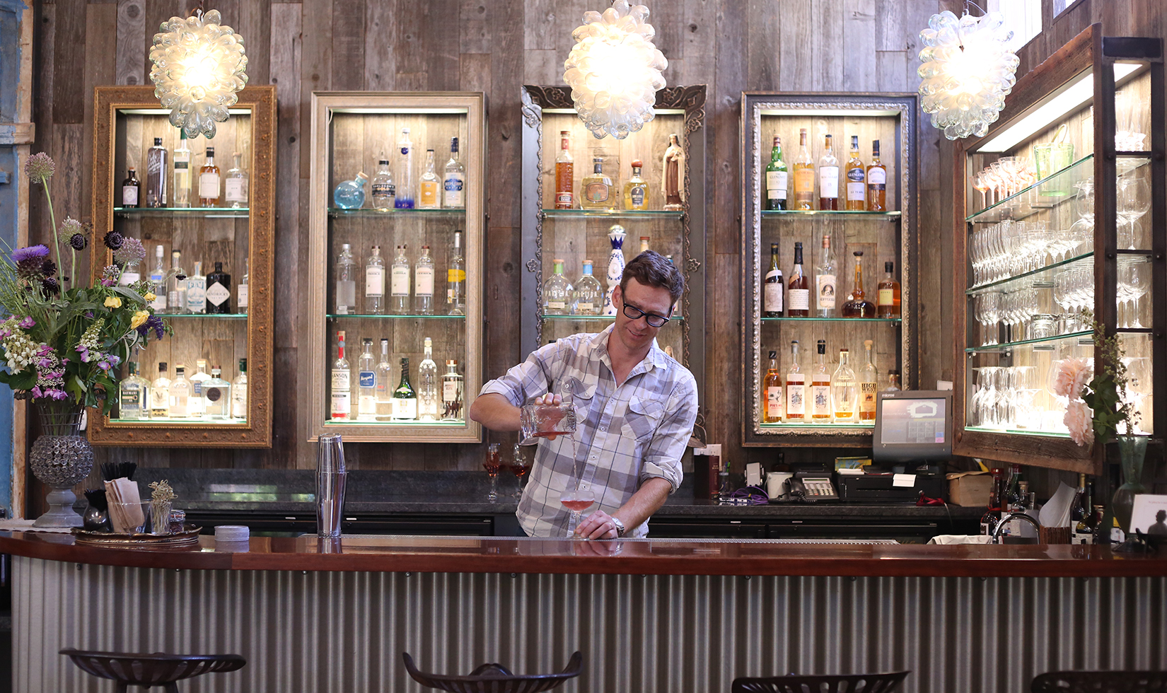 bartender pouring a drink at Barndiva Gallery Bistro bar