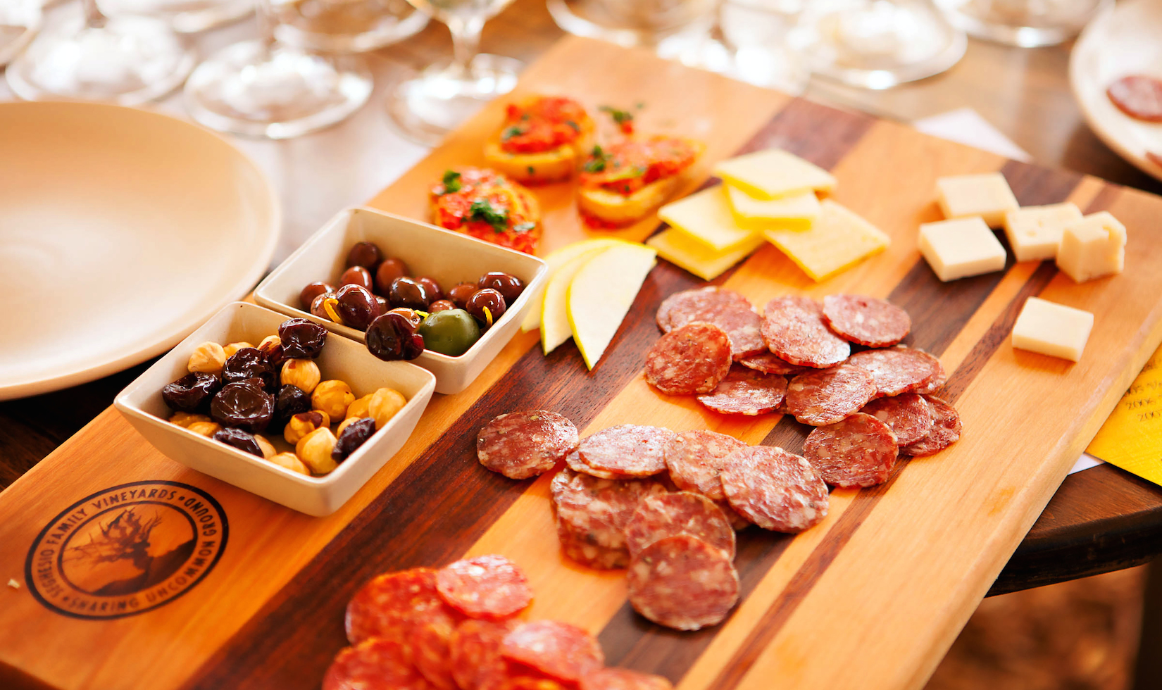 Best Wineries in Healdsburg lot of delicious food delicacy, cheese, charcuterie, nuts in the table