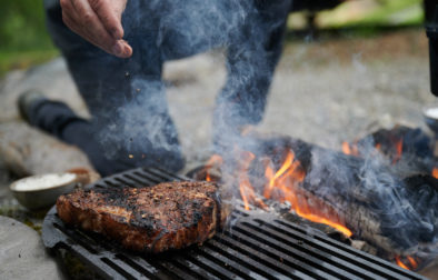 meat grilling on a open fire
