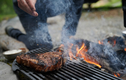 meat grilling on a open fire