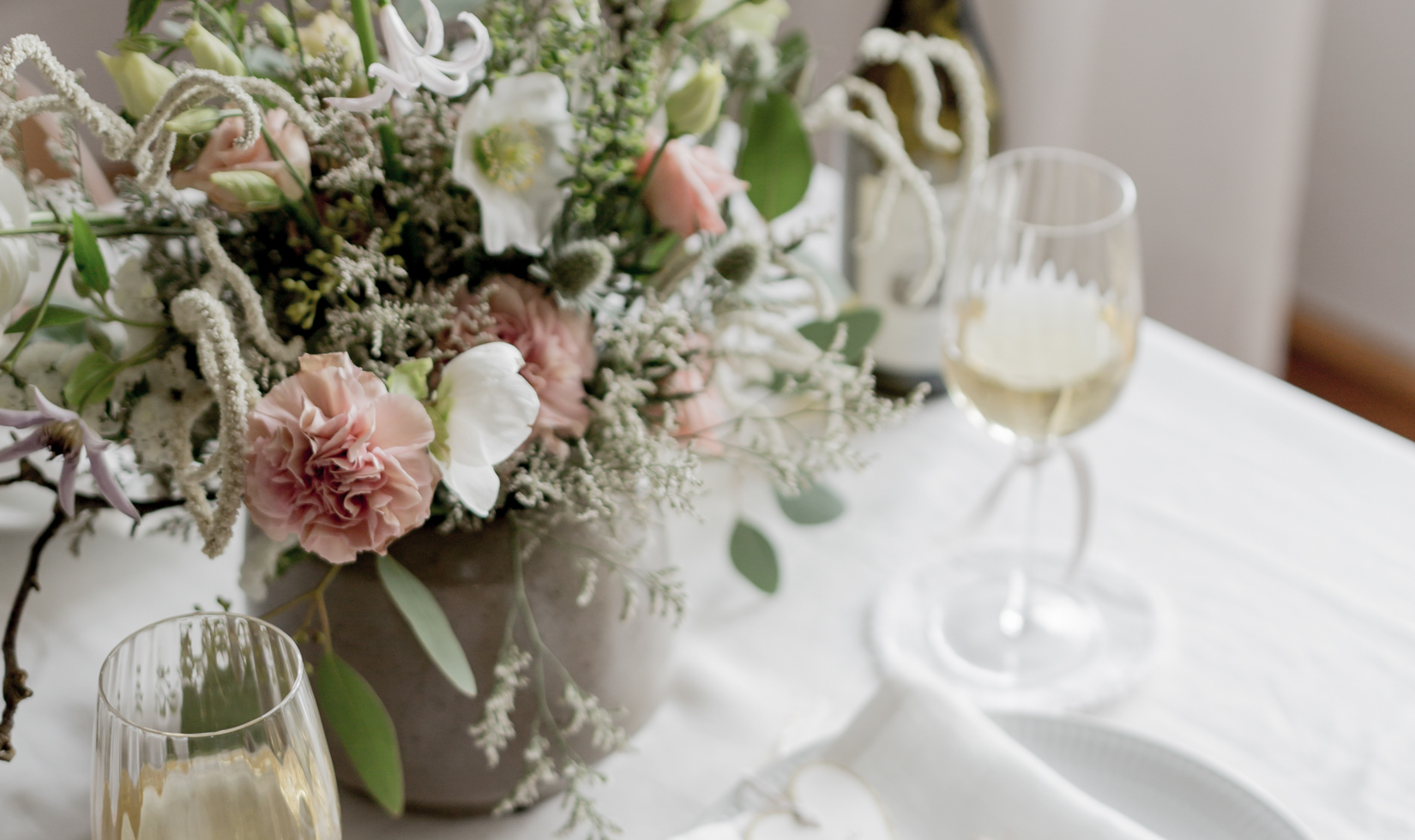 beautiful flowers in centerpiece table with wine glasses