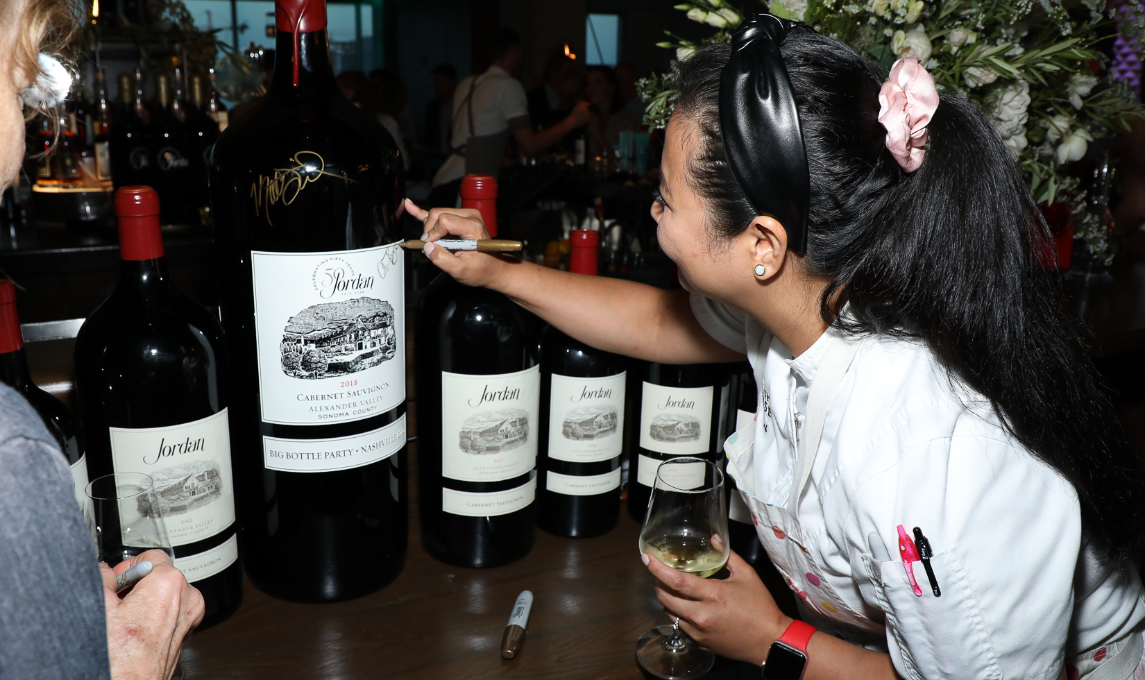 Big Bottles of Wine 1 Chefs signing big bottles of Jordan Cabernet Sauvignon at Jordan's Big Bottle Party in Nashville.