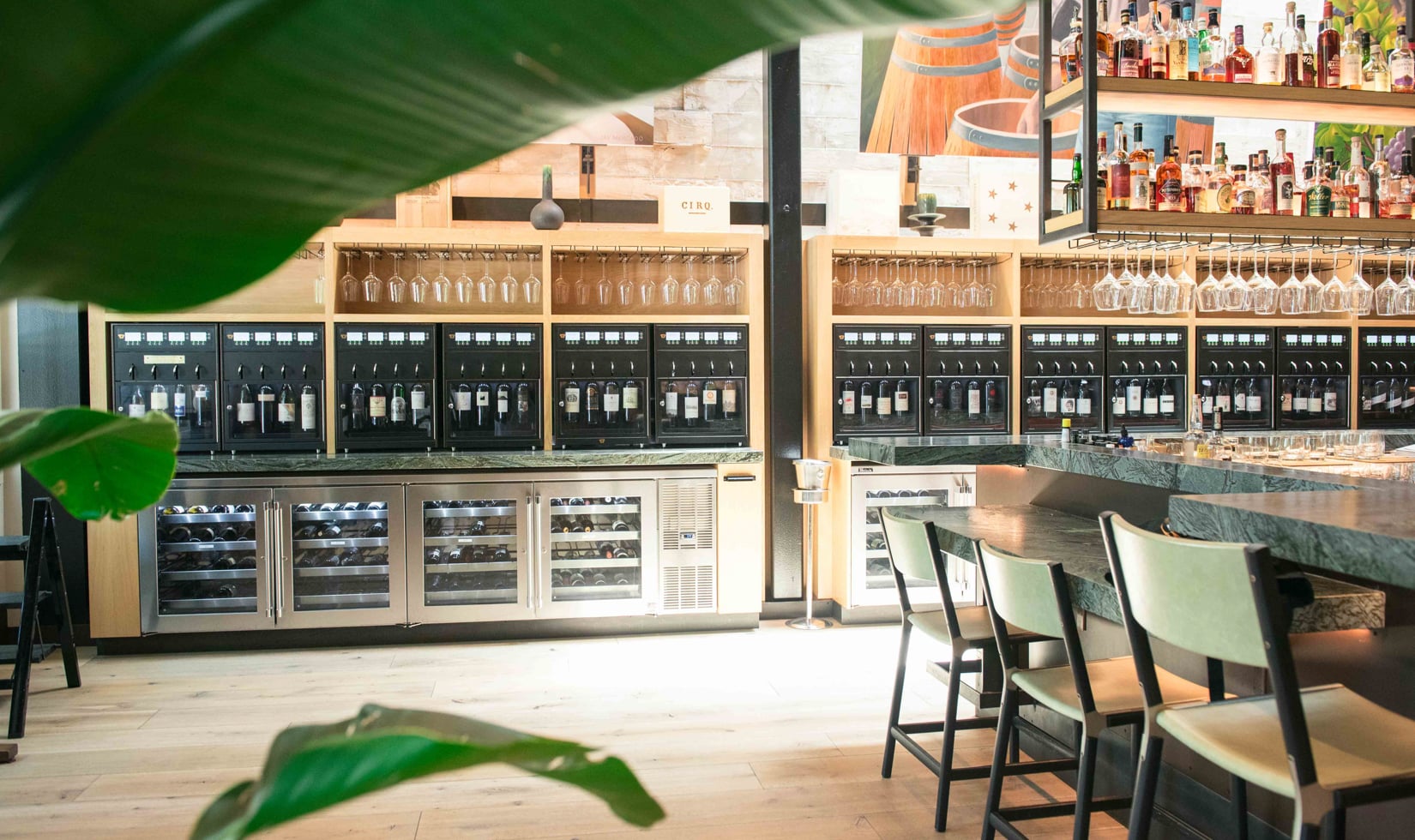 How to Read a Wine List Image 1 interior of wine wall with many wine bottles on display at a bar