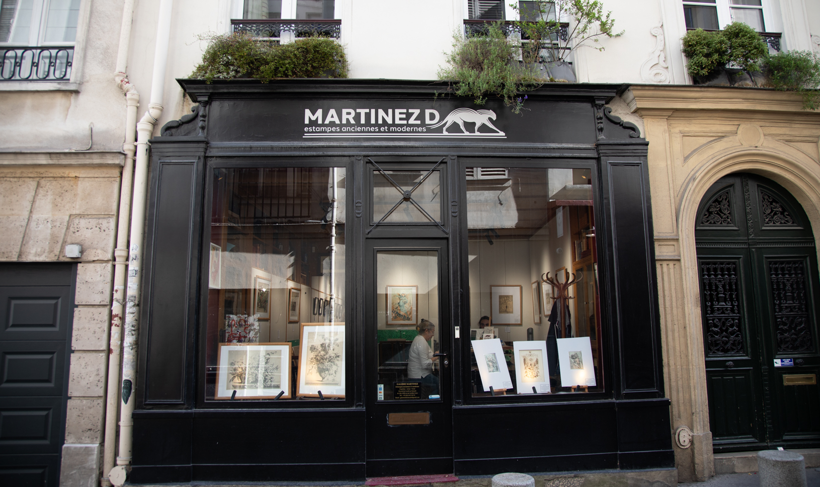 street view of a black and white French gallery